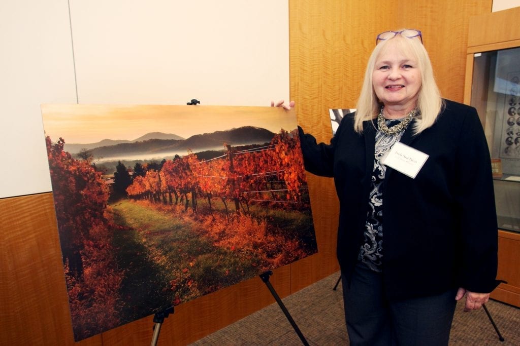 Deb Snelson with her photograph "Autumn on the Vine," our 2016 Best in Show Winner.